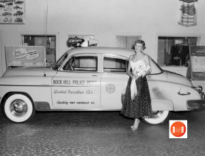 Huey Motor Company routinely donated vehicles to the police department. This image taken at their location on South Oakland Avenue. Courtesy of the Deas Collection - John Aiton, 2015