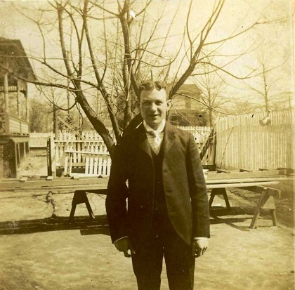 Dolph Friedheim standings in his side yard circa 1890 showing the original manse in the rear.