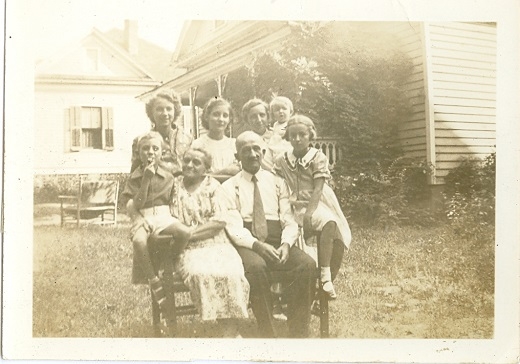 The Parker Family in their front yard with the Bryant home at #126 Johnston St., showing in the background.
