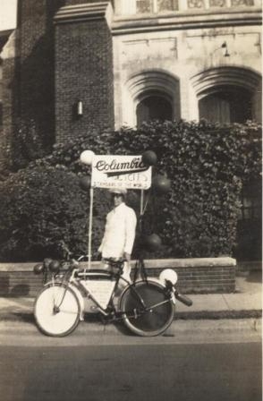 J.S. White, Jr. stands with his bicyle on South Oakland Avenue in front of Saint John’s Methodist Church
