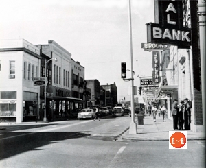 Main Street showing the bank and Brooks Jewelers on the right corner.