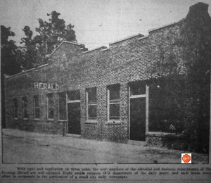 View of the Herald Newspaper office being operated from the commercial area where the First Baptist Church had been incorporated into the building.