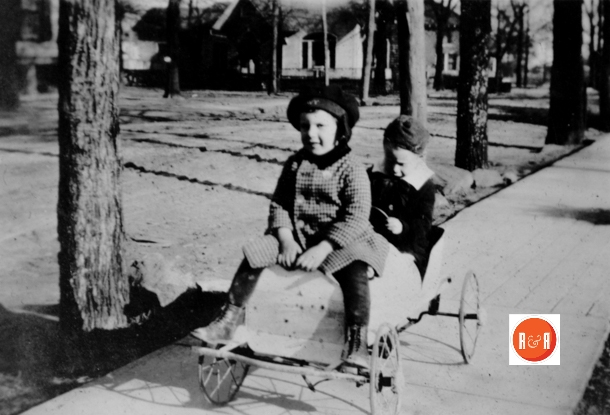 Frances Craig and her brother Narnie Craig play on Johnston Street, the Craig-Ferguson home can be seen behind them to the left corner.