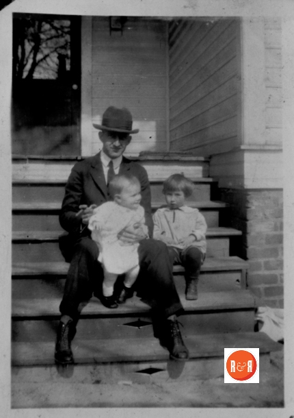N.B. Craig with his children on the front steps of his home.