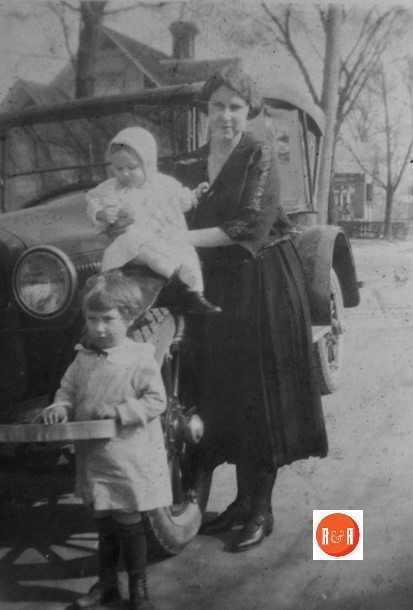 Mrs. Craig with her children on Johnston Street in front of their home.