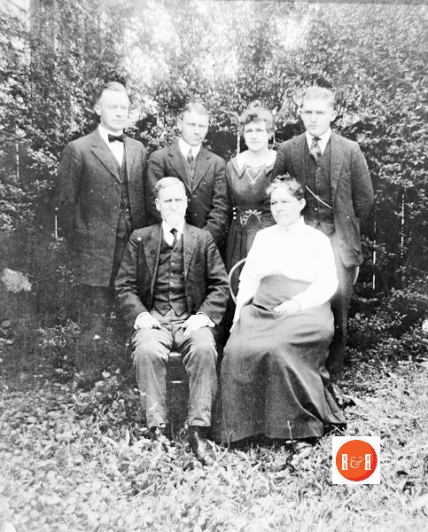 Members of the David Hutchison family (April – 1918), in the front yard of their Johnson St., home including: David and Kate Hutchison with their four children from (No order); Thomas Johnston Hutchison, William Campbell Hutchison, Kate Hutchison and David Hutchison