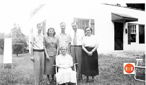 Members of the Givens family in the backyard of their home.