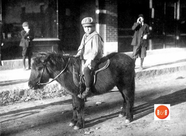 Wallace Fennell, M.D. as a young boy riding his pony down Rock Hill’s East Main Street.