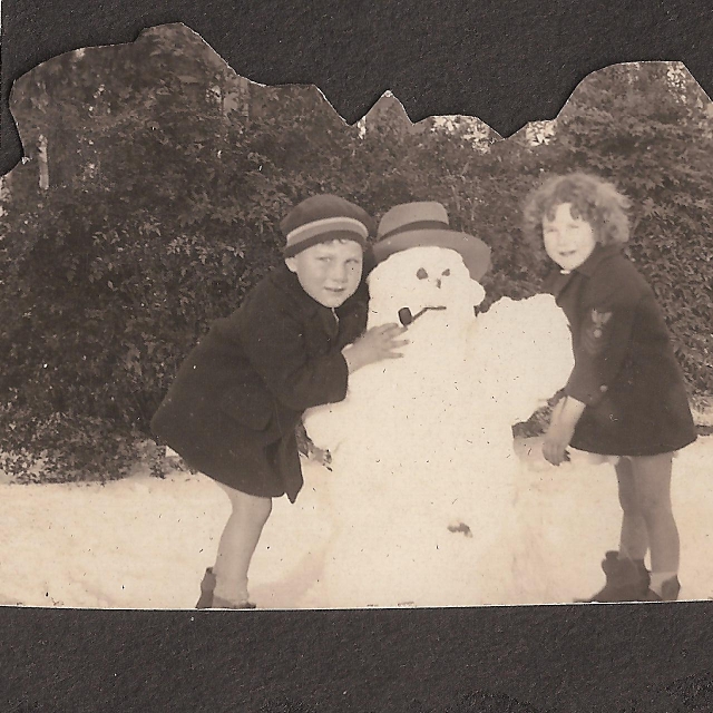 A young Wm. Frank Strait, M.D. and his cousin Bettie Baskin Roddey – Lobato in 1933 playing in the snow at this address, on one of her visits to her grandfather – Joe Roddey on Oakland Avenue.  OPEN ENLARGEMENT OF THE KINDERGARTEN SCHOOL IMAGE - 1935