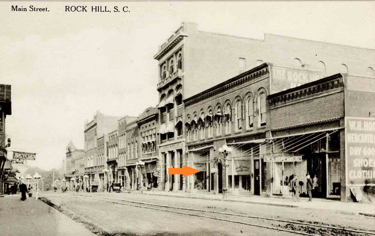 Arrow showing the location of the RH Supply Co., courtesy of the Allen Postcard Collection - 2012