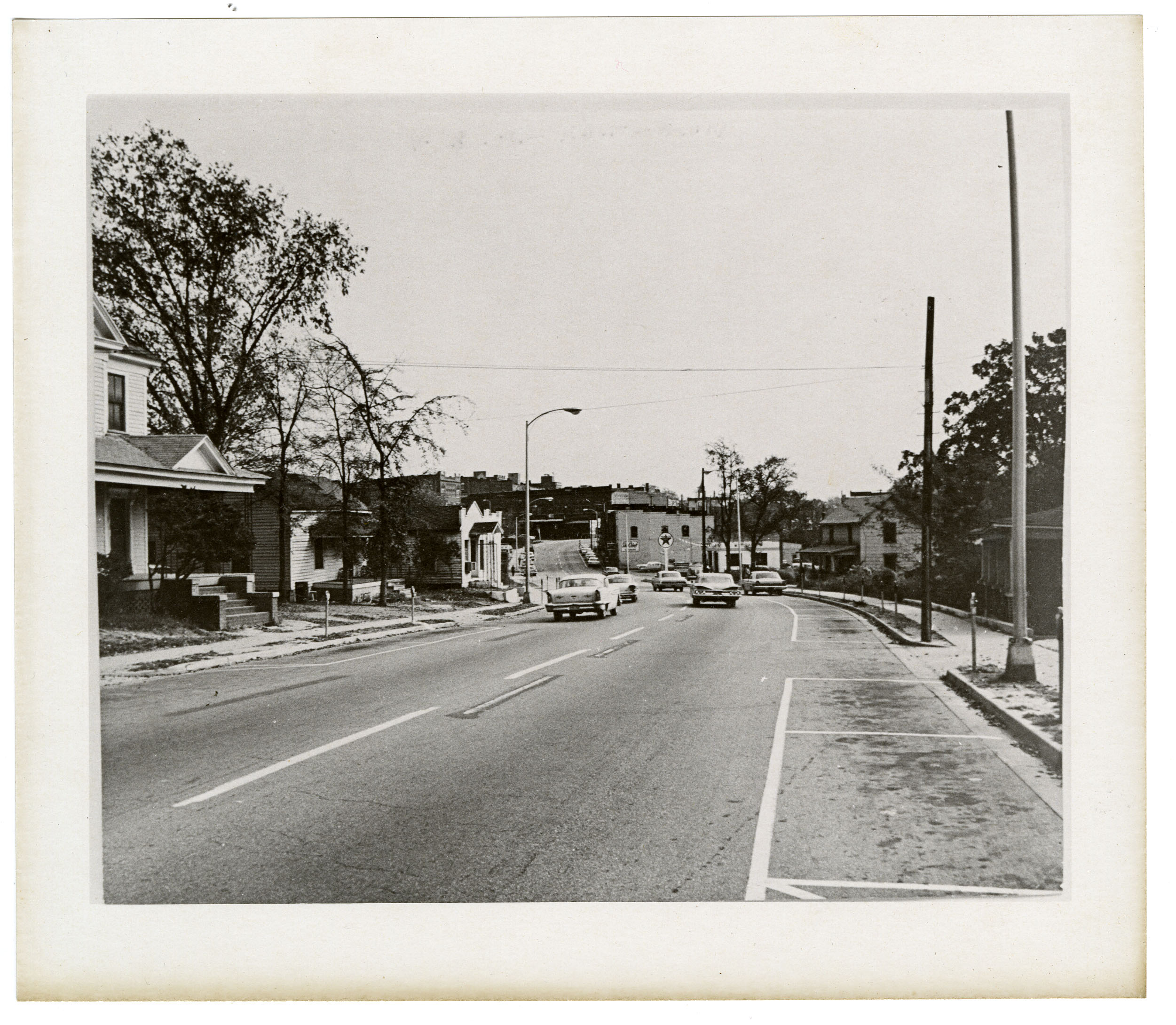 Old West Black Street as viewed from the corner of Wilson St., looking east toward downtown Rock Hill.  Gathing's Drugstore on the left, ca. 1960's.  Courtesy of the WU Pettus Archives - 2023