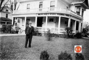 Mr. Todd standing in the front yard of the Todd Funeral Home in circa 1950.