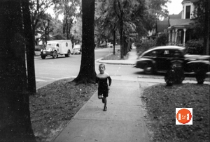 Hal Todd running up North Confederate Avenue in Sept. of 1950. Note the house in the background (2015 a parking lot), the Robbins – White Tour states, “Opposite the McDonaEhouse, on White Street, was the large two-story frame residence of Maj. and Mrs. William W. Boyce (later of Mr. and Mrs. W. B. Roddey). This house had entrances on both Confederate· Avenue and White Street.”