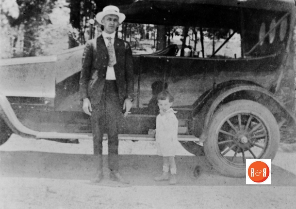 Mr. Craig with daughter Nancy showing off his early automobile.