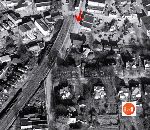 The arrow points to the area of buildings used for the restaurant. AFLLC Collection