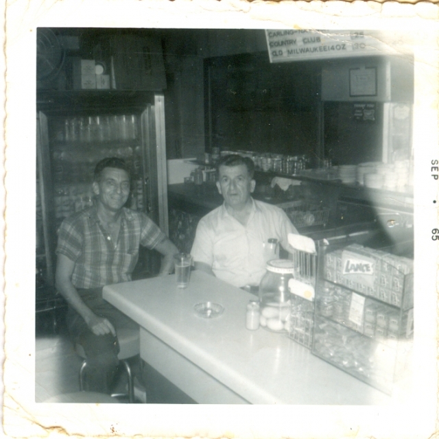 J.G. Moses and customer Ralph Howell, 1965.