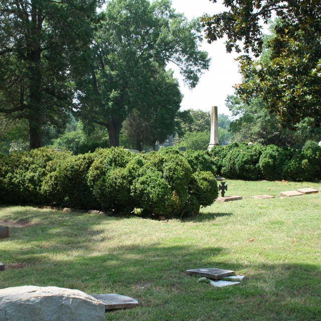 Historic plantings of English Boxwood, American Magnolia and other plantings abound at the historic cemetery.