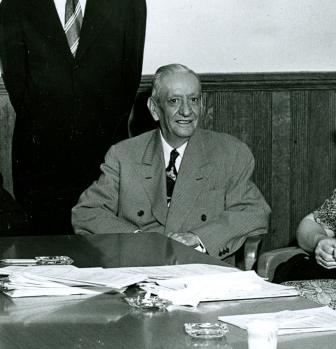 C.L. Cobb sitting at the Peoples National Bank
