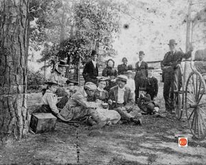 Mr. S. J. Kimball standing (rt) with a group picnicking in circa 1900.