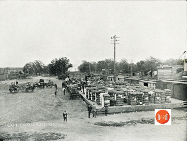 View of the cotton platform across from North Trade Street on the west side of the railroad. Image taken in 1895.